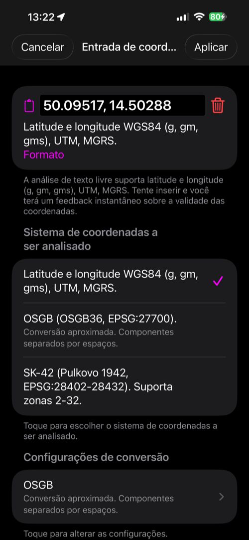 O conversor de coordenadas aberto a partir do editor de pontos, com a latitude e a longitude do ponto no campo de entrada, a lista de formatos reconhecidos e Cancelar e Aplicar na barra