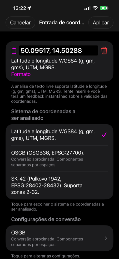O conversor de coordenadas aberto a partir do editor de pontos, com a latitude e a longitude do ponto no campo de entrada, a lista de formatos reconhecidos e Cancelar e Aplicar na barra